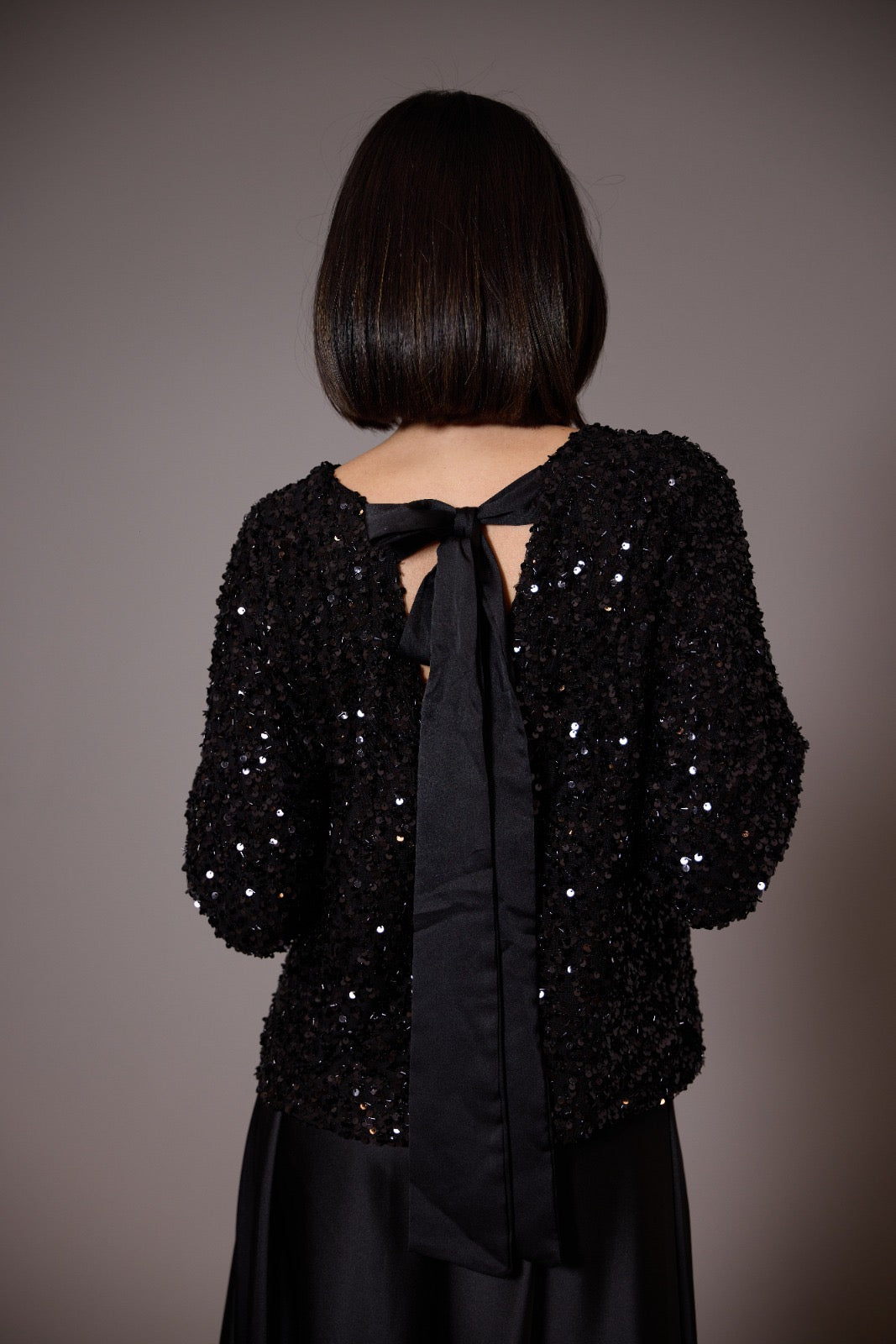 Sequined top with black bow on the neck Luisa Fashion